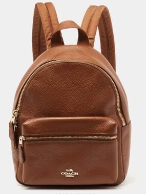 Coach 
Tan Pebbled Leather - Mini Charlie Backpack with Gold Hardware